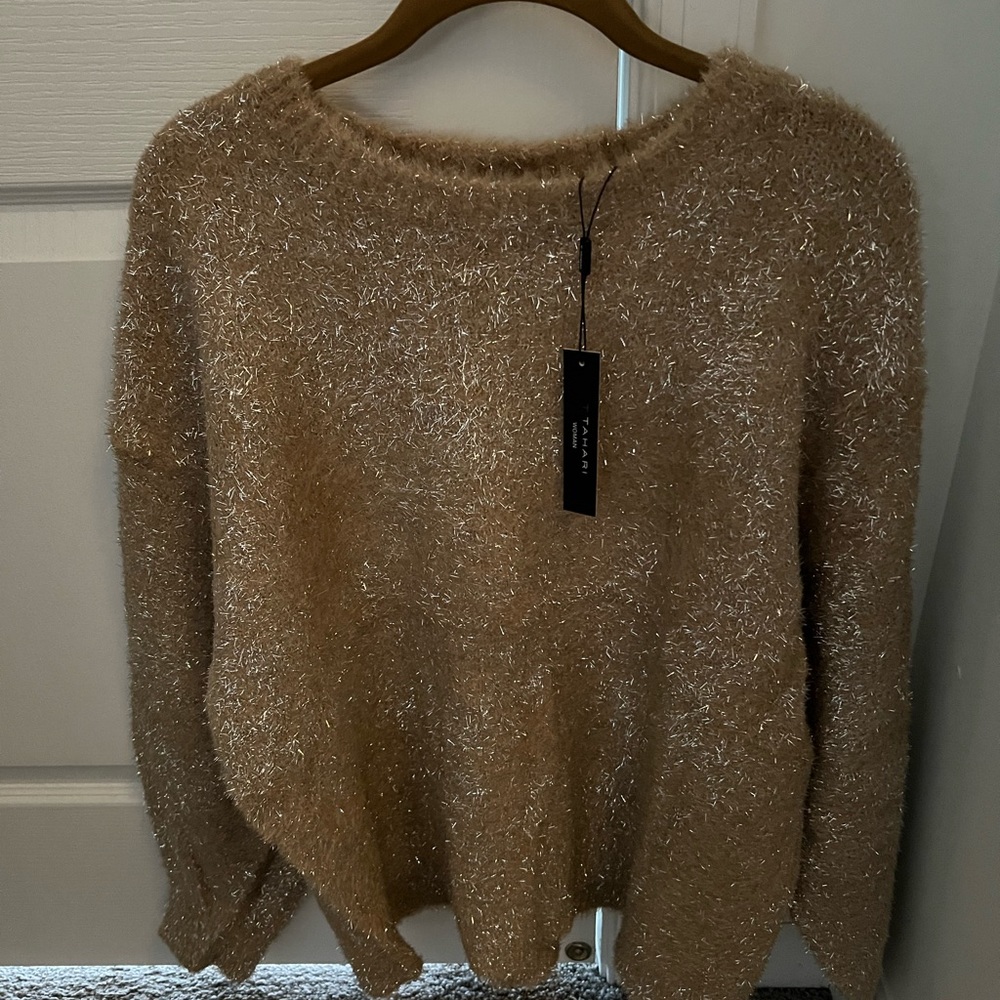 Bought this beautiful Tahari woman sweater.